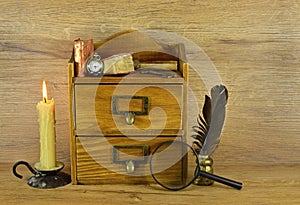 Wooden box with written implements photo