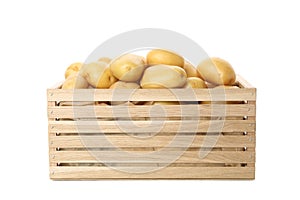 Wooden box with young potato isolated on white