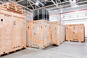 Wooden boxes in the warehouse. Boxes out of wood for packing industrial machinery. Warehousing. Packaging of finished
