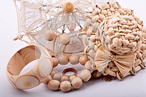 Wooden bracelet, earrings, ring on white background.