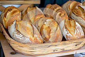 wooden bread basket with freshly baked loaves on display