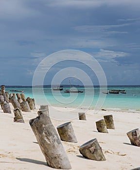 Wooden breakwaters on the beach