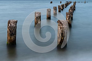 Wooden breakwaters on the sea shore