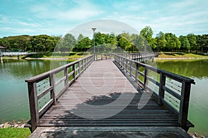 Wooden bridge across the lake at S2 City Park, Seremban 2, Malaysia