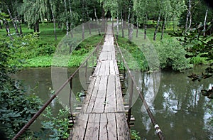 Wooden bridge across the river