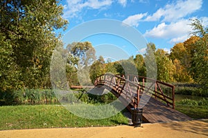 Wooden bridge across small river