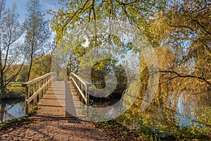 Wooden bridge in an autumnal landscape