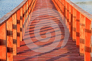 Wooden bridge with beautiful light and shadow in the sea in Bangkok Thailand