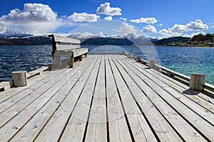 Wooden bridge with bench