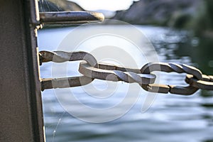 Wooden Bridge chains in a river of Pirineos photo