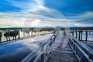 Wooden bridge cross around marsh in sunset time at Sam Roi Yot National Park,Thailand