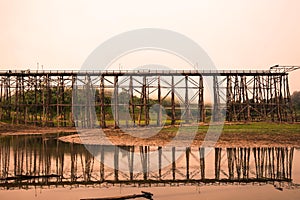 Wooden bridge crosses over river at KANCHANABURI of Thailand