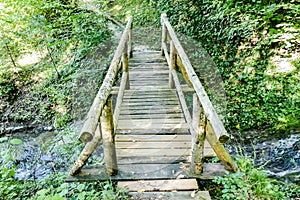 wooden bridge in the forest, digital photo picture as a background , taken in bled lake area, slovenia, europe photo