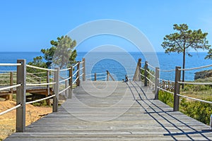 Wooden bridge going to the sea.