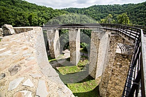 Wooden bridge held by massive rock pillars leads the way into the Neamt Citadel is a medieval fortress located in north-eastern