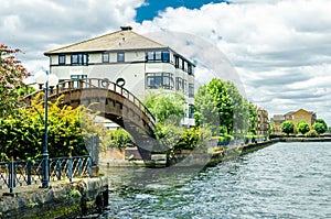 A wooden bridge and houses at the London Docklands photo