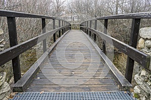 Wooden Bridge, Natural Park of Las Presillas, in Navacerrada, wa photo