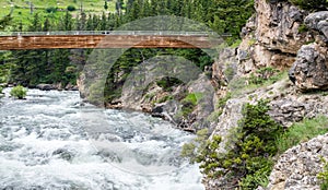 Wooden bridge over the Boulder River in Montana photo