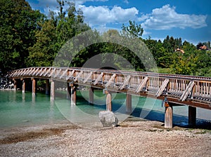 Wooden bridge over the Mangfall river, which rises from the Tegernsee