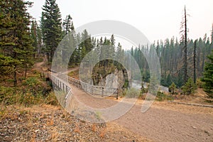 Wooden Bridge over Meadow Creek Gorge for hiking and horseback packing trail in the Bob Marshall Wilderness area in Montana USA