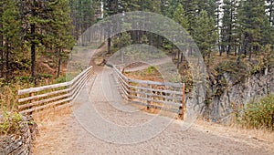 Wooden Bridge over Meadow Creek Gorge for hiking and horseback packing trail in the Bob Marshall Wilderness area in Montana USA