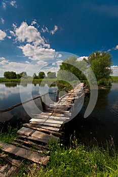 Wooden bridge over a pond