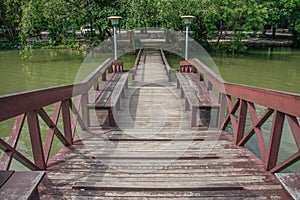 Wooden bridge over pond