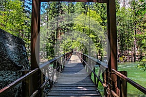 Wooden bridge over the raging King River in Kings Canyon National Park