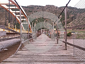 wooden bridge over river photo