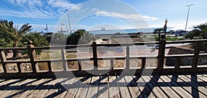 Wooden bridge over sheltered sandy beach photo