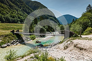 Wooden bridge over Soca river in Slovenia