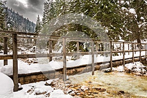 Wooden bridge over Triglav Bistrica creek near Pricnik waterfa