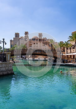 Wooden bridge over waterway in Souk Madinat Junction mall