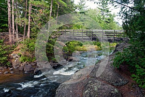 Wooden bridge at the Pike River, Marinette County,Wisconsin, USA photo