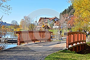 Wooden bridge on the promenade of Lake Hopfensee, with the Allg u Alps in the background, Allg u, Schwaben, Bavaria, Germany