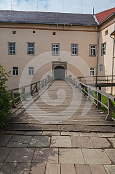 Wooden bridge with railing to the arch of the entrance to the castle. Transcarpathia Uzhhorod Ukraine