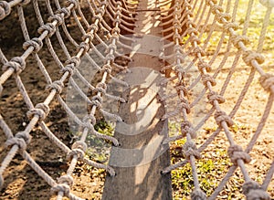 Wooden bridge with strong robe at playground in school.