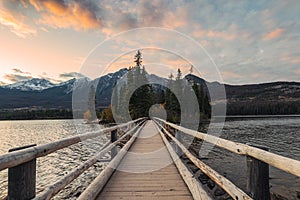Wooden bridge with Tiny island in the evening on Pyramid lake at Jasper national park
