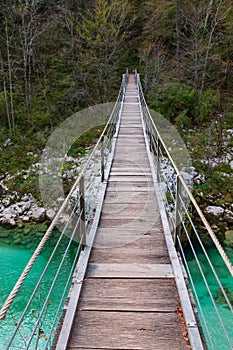 Wooden bridge the turquoise green Soca river