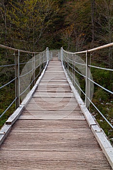 Wooden bridge the turquoise green Soca river