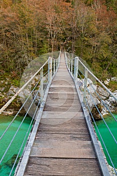 Wooden bridge the turquoise green Soca river