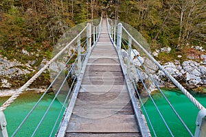 Wooden bridge the turquoise green Soca river