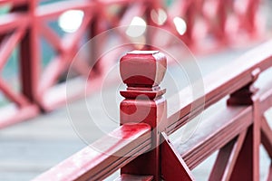 Wooden bridge in Vietnam. Focus on rails.