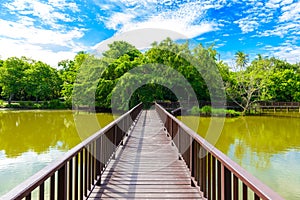 Wooden bridge walkway in Sri Nakhon Khuean Khan Park and Botanic