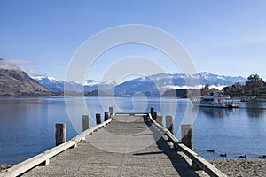 Wooden bridge at Wanaka lake in New Zealand