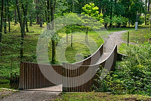 Wooden bridge in Wellness city park of Karolis Dineika, Druskininkai, Lithuania. Popular tourist destination