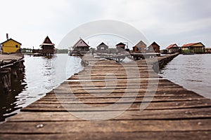 Wooden bridges on the Lake Bokod. Fishing wooden cottages, Hungary