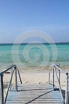 Wooden brigde in a Exotic beach in Cuba