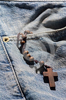 Wooden brown cross with rosary crown