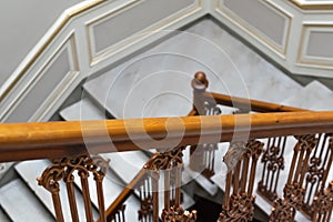 wooden brown old railing on marble stairs